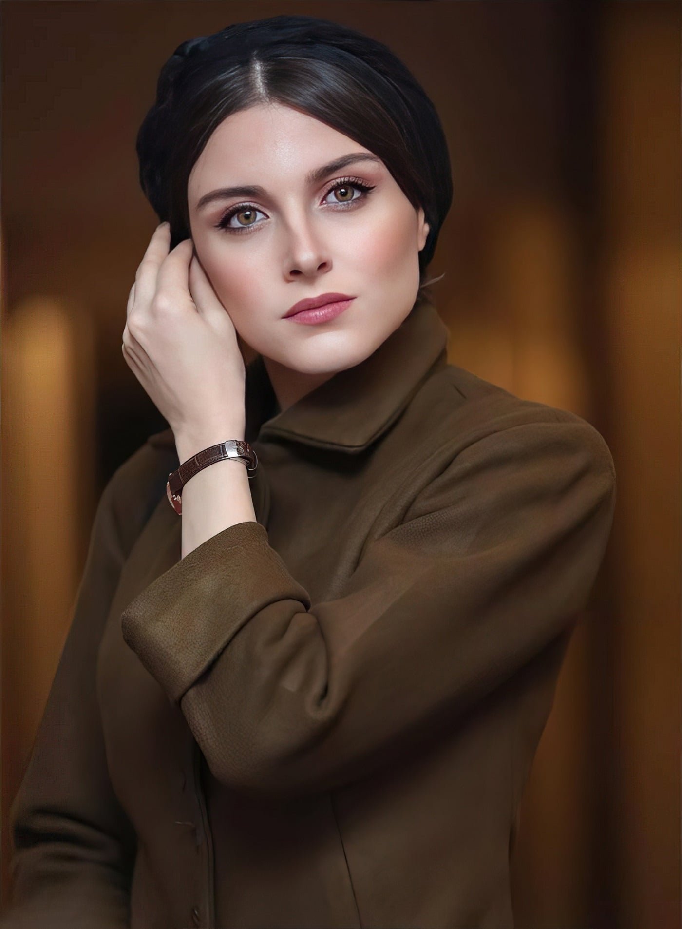 persian actress with long dark hair wearing a white embroidered traditional gown looking away from camera